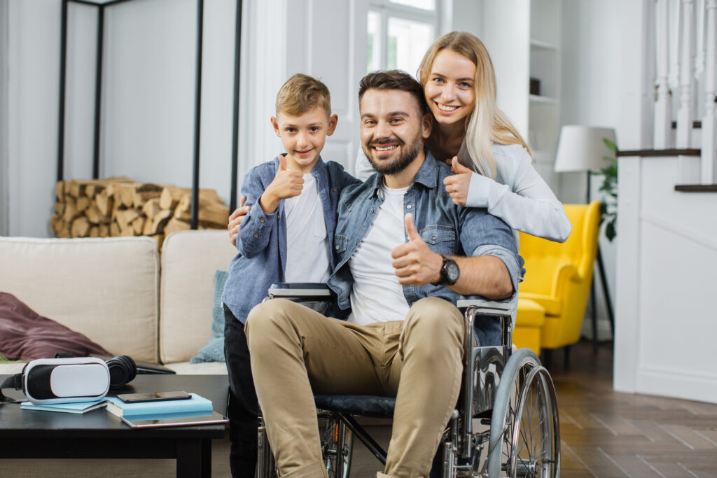 Family with disabled father posing